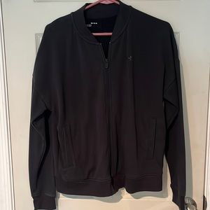 Black zip up bomber style jacket.